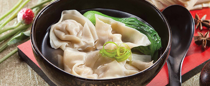 Bowl of foodservice Amoy Pork Wontons in a restaurant setting