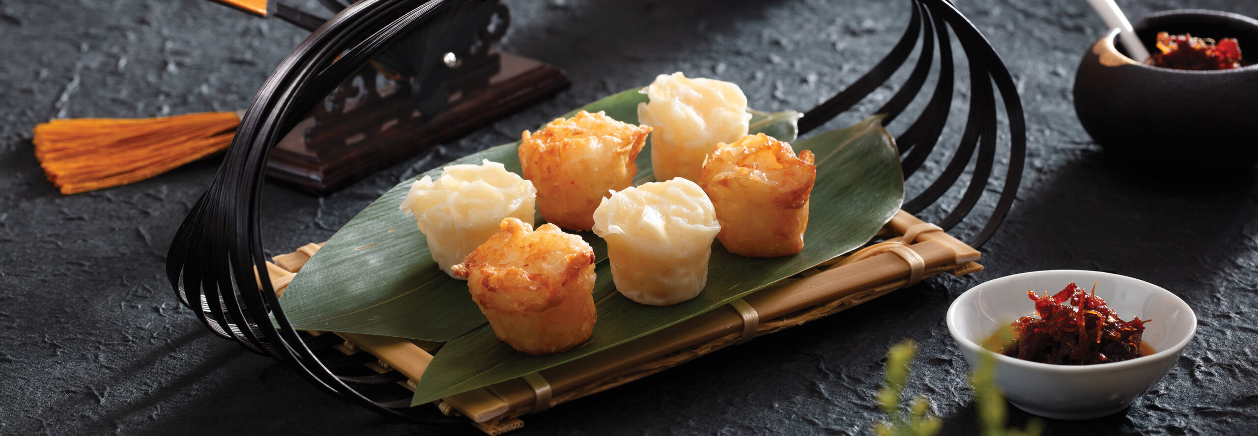 SHRIMP SHAOMAI plated on asian inspired serving tray