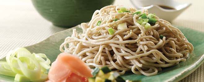 pile of soba buckwheat noodles on teal asian style dish